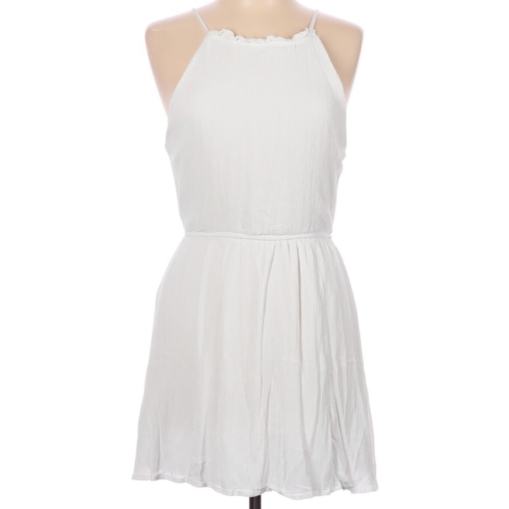 Knee length white dress with elastic waist and ties in the back